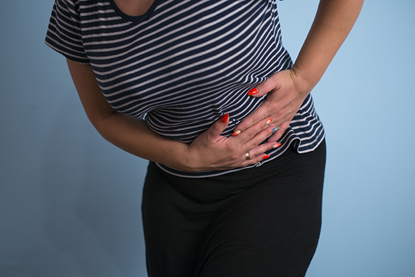 Why women have Irregular periods and abdominal cramps in PCOS